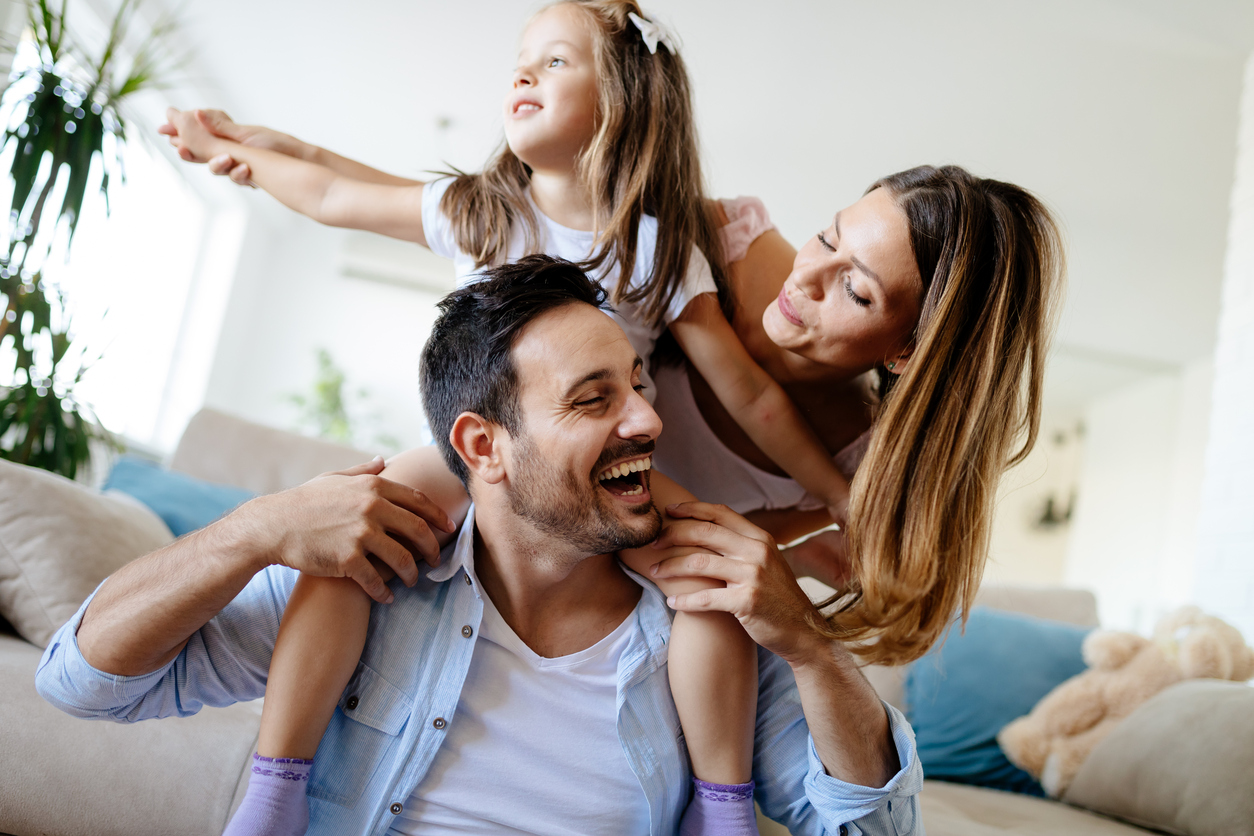 Happy family having fun times at home together